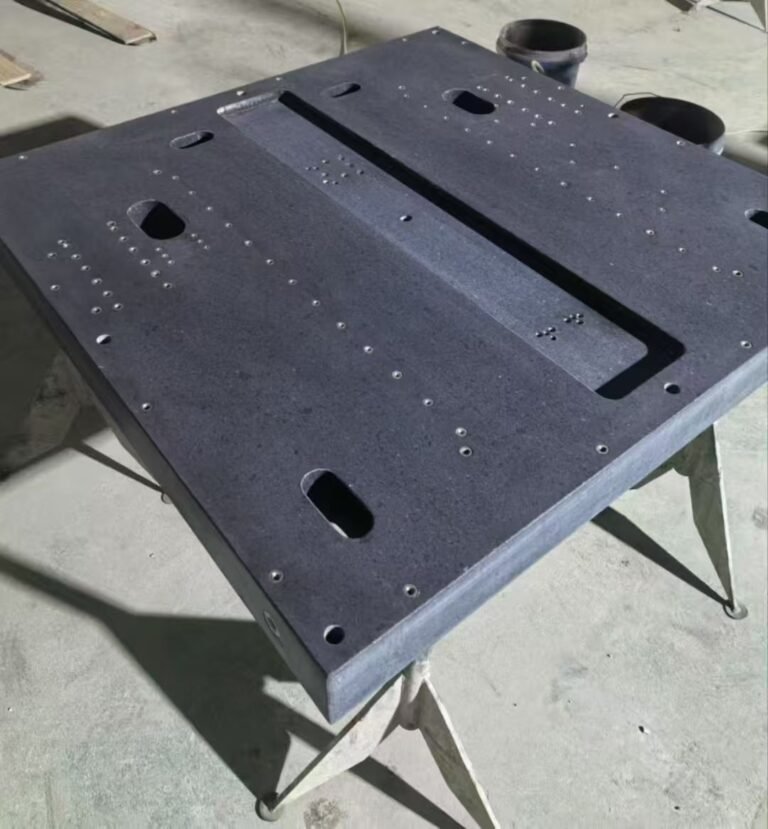 Why do I apply a layer of oil to the granite base before shipping?