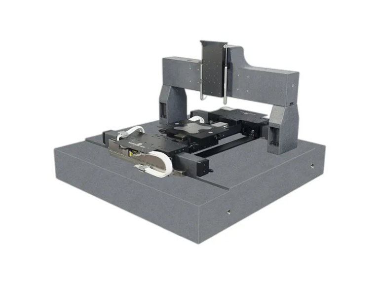 What is the achievable flatness of a high-precision granite machine base with threaded inserts?